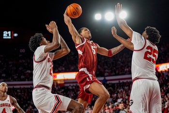 Jan 17, 2026; Athens, Georgia, USA; Arkansas Razorbacks guard Darius Acuff Jr. (5) tries to get to the basket against Georgia Bulldogs forward Justin Abson (25) during the second half at Stegeman Coliseum. Mandatory Credit: Dale Zanine-Imagn Images