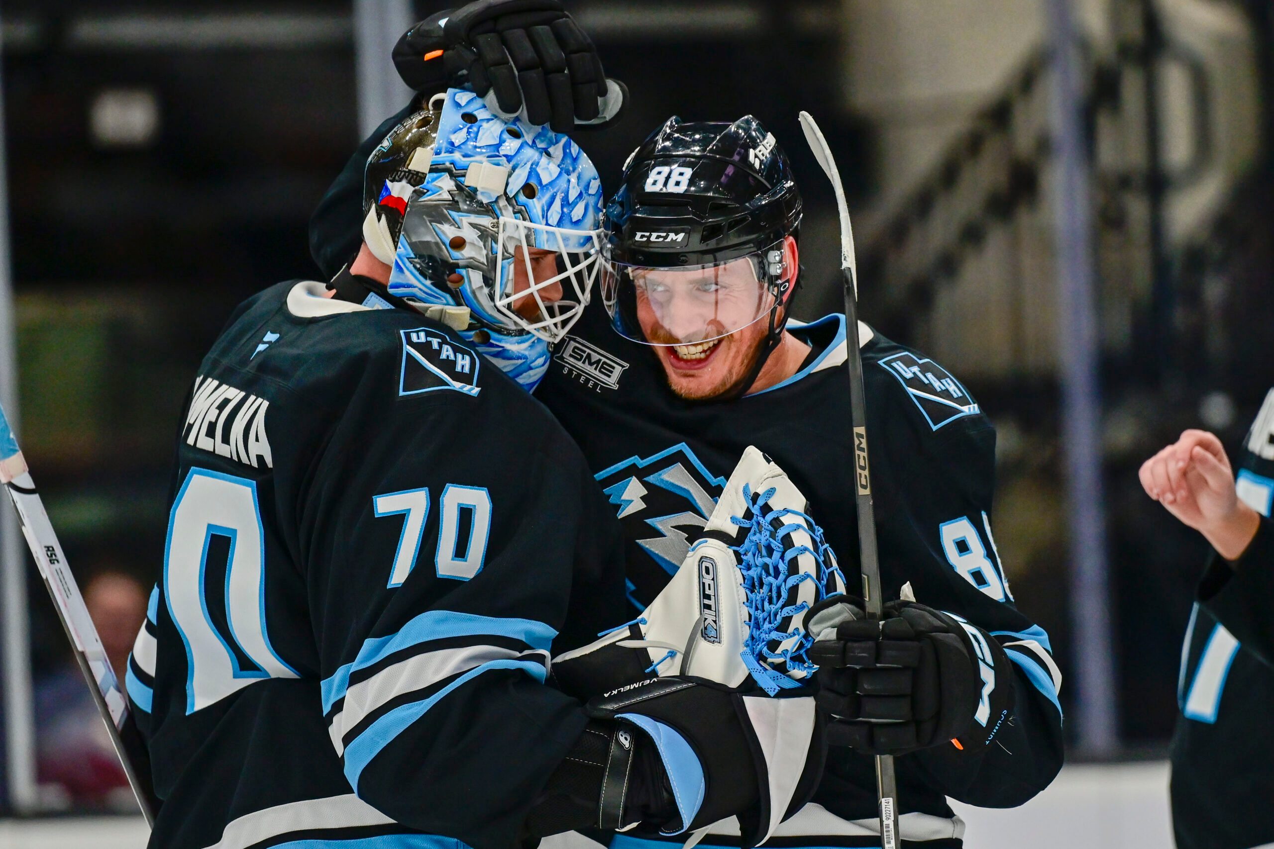 Jan 17, 2026; Salt Lake City, Utah, USA; Utah Mammoth goalie Karel Vejmelka (70) and Utah Mammoth defenseman Nate Schmidt (88) celebrate their win after the game against the Seattle Kraken at Delta Center. Mandatory Credit: Peter Creveling-Imagn Images