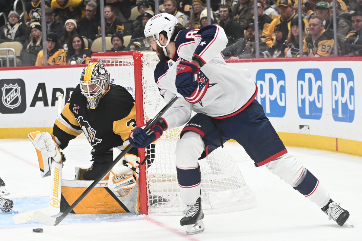 Jan 17, 2026; Pittsburgh, Pennsylvania, USA;  Columbus Blue Jackets right wing Kirill Marchenko (86) pressures Pittsburgh Penguins goalie Arturs Silovs (37) during the second period at PPG Paints Arena. Mandatory Credit: Philip G. Pavely-Imagn Images