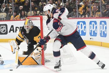 Jan 17, 2026; Pittsburgh, Pennsylvania, USA;  Columbus Blue Jackets right wing Kirill Marchenko (86) pressures Pittsburgh Penguins goalie Arturs Silovs (37) during the second period at PPG Paints Arena. Mandatory Credit: Philip G. Pavely-Imagn Images