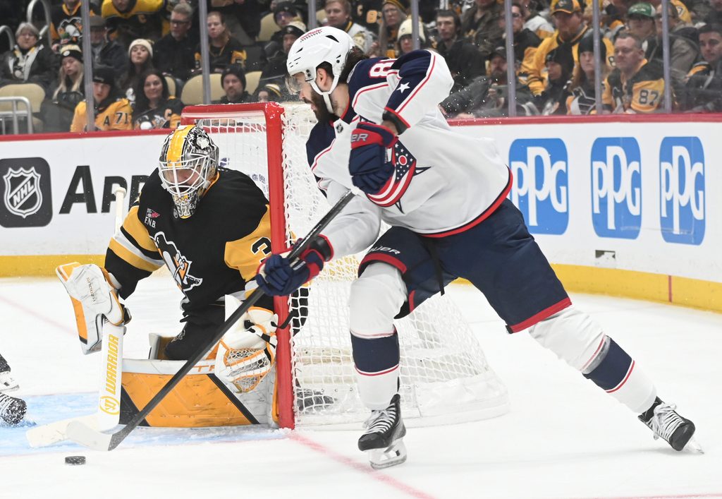 Jan 17, 2026; Pittsburgh, Pennsylvania, USA; Columbus Blue Jackets right wing Kirill Marchenko (86) pressures Pittsburgh Penguins goalie Arturs Silovs (37) during the second period at PPG Paints Arena. Mandatory Credit: Philip G. Pavely-Imagn Images