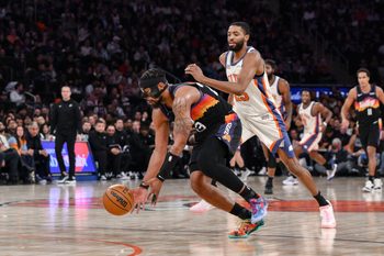 Jan 17, 2026; New York, New York, USA; Phoenix Suns guard Jordan Goodwin (23) gathers a loose ball as New York Knicks guard Mikal Bridges (25) defends during the second half at Madison Square Garden. Mandatory Credit: John Jones-Imagn Images