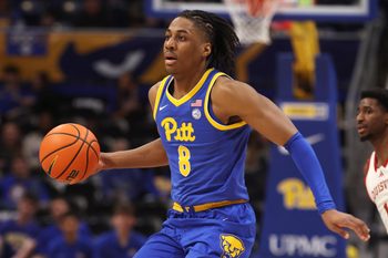 Jan 17, 2026; Pittsburgh, Pennsylvania, USA; Pittsburgh Panthers guard Omari Witherspoon (8) dribbles the ball against the Louisville Cardinals during the second half at the Petersen Events Center. Mandatory Credit: Charles LeClaire-Imagn Images