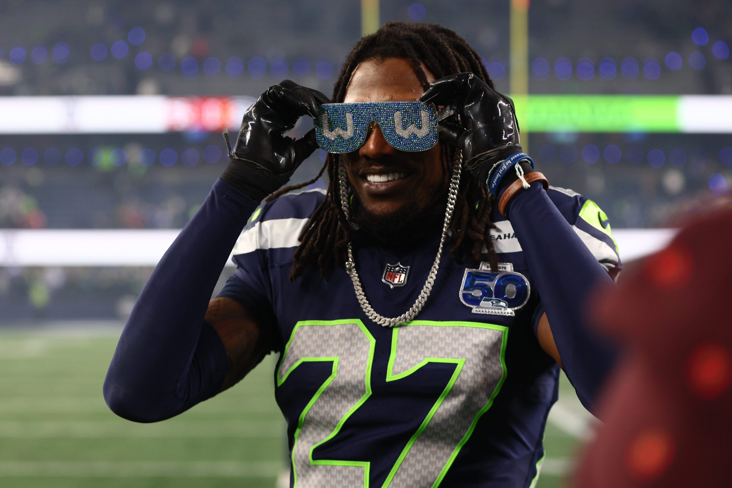 Jan 17, 2026; Seattle, WA, USA;  Seattle Seahawks cornerback Riq Woolen (27) celebrates following an NFC Divisional Round game against the San Francisco 49ers at Lumen Field. Mandatory Credit: Kevin Ng-Imagn Images