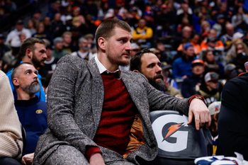 Jan 17, 2026; Denver, Colorado, USA; Denver Nuggets center Nikola Jokic (15) looks on from the bench in the third quarter against the Washington Wizards at Ball Arena. Mandatory Credit: Isaiah J. Downing-Imagn Images