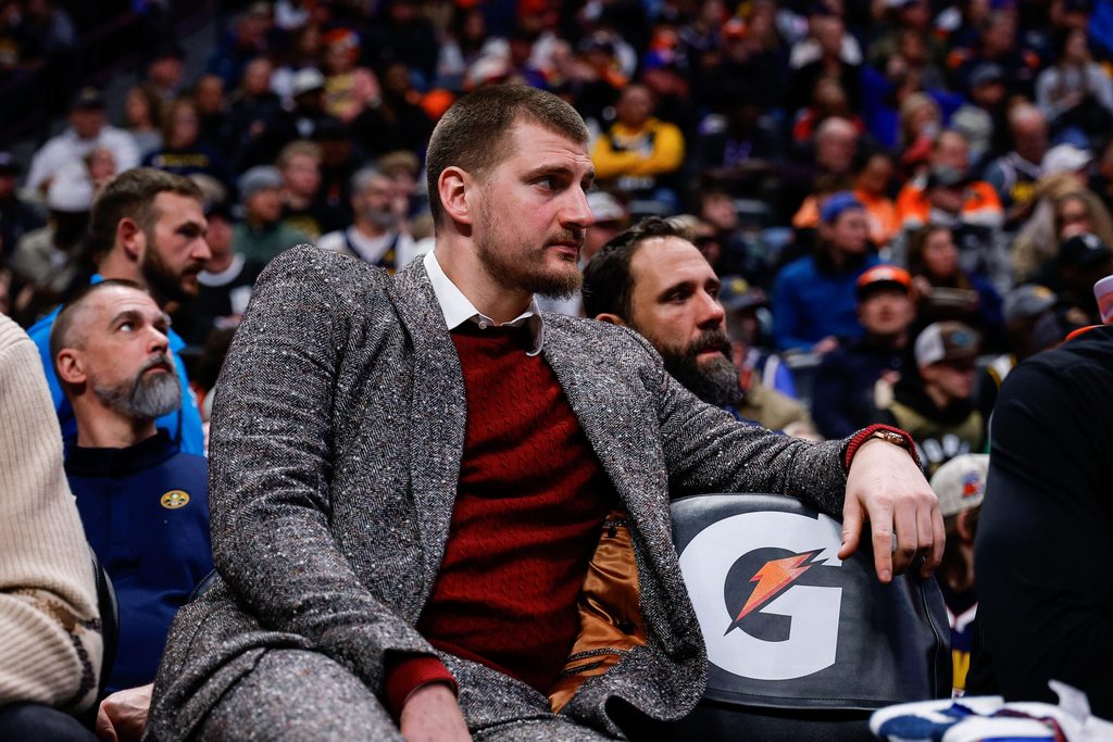 Jan 17, 2026; Denver, Colorado, USA; Denver Nuggets center Nikola Jokic (15) looks on from the bench in the third quarter against the Washington Wizards at Ball Arena. Mandatory Credit: Isaiah J. Downing-Imagn Images