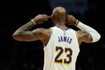Jan 17, 2026; Portland, Oregon, USA; Los Angeles Lakers forward LeBron James (23) cups his ears as he looks to the coach for a play call during the second half against the Portland Trail Blazers at Moda Center. Mandatory Credit: Troy Wayrynen-Imagn Images