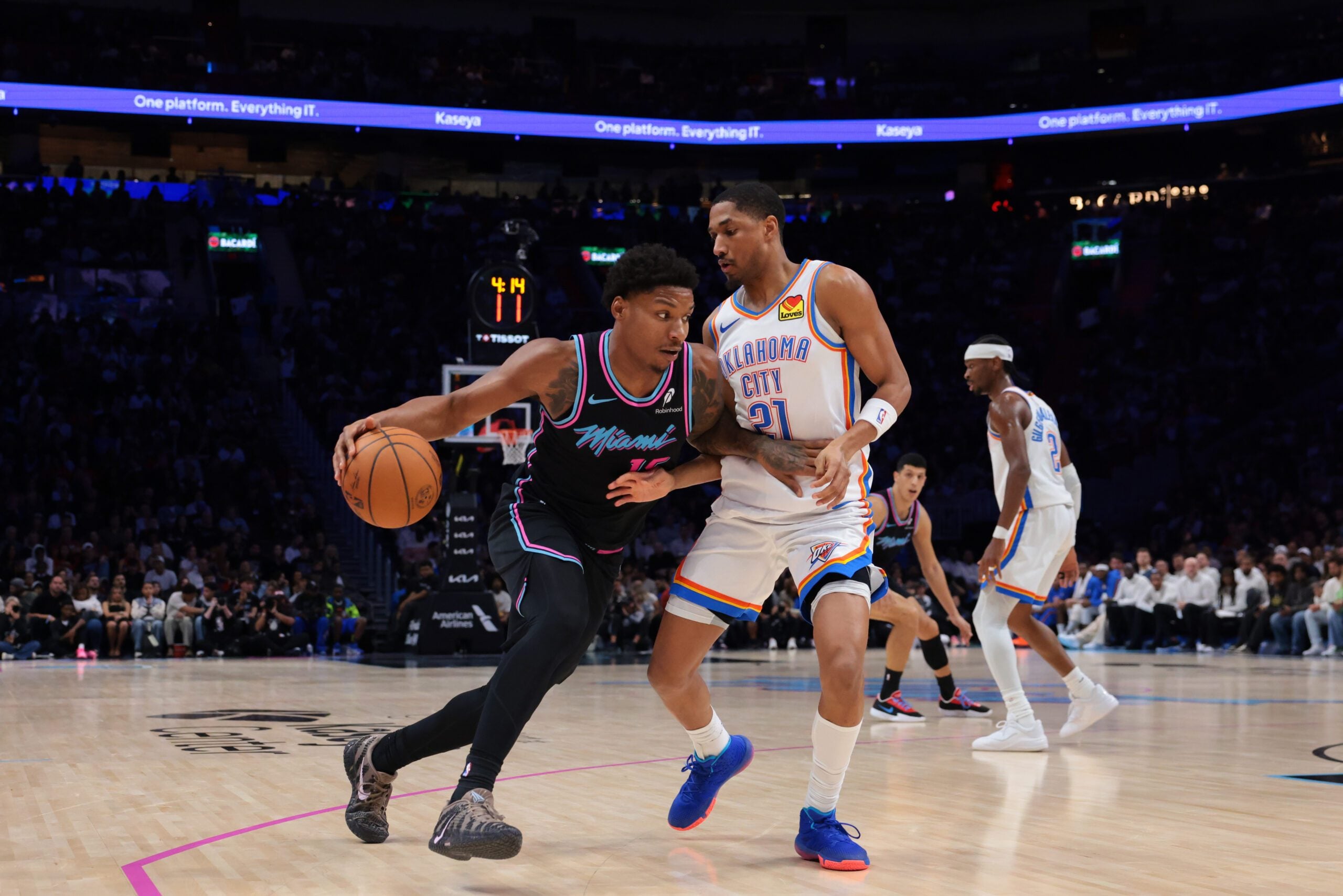 Jan 17, 2026; Miami, Florida, USA; Miami Heat forward Myron Gardner (15) drives to the basket against Oklahoma City Thunder guard Aaron Wiggins (21) during the third quarter during the third quarter at Kaseya Center. Mandatory Credit: Sam Navarro-Imagn Images