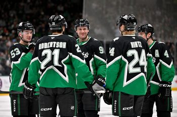Jan 18, 2026; Dallas, Texas, USA; Dallas Stars center Wyatt Johnston (53) and left wing Jason Robertson (21) and right wing Mikko Rantanen (96) and center Roope Hintz (24) and defenseman Miro Heiskanen (4) huddle before a power play against the Tampa Bay Lightning during the second period at the American Airlines Center. Mandatory Credit: Jerome Miron-Imagn Images