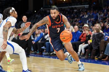 Jan 18, 2026; Memphis, Tennessee, USA; UTSA Roadrunners guard Jamir Simpson (7) drives against Memphis Tigers guard Dug McDaniel (1) during the second half at FedExForum. Mandatory Credit: Wesley Hale-Imagn Images
