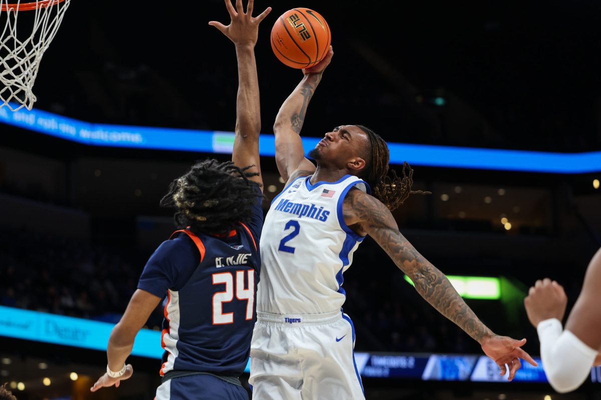 Jan 18, 2026; Memphis, Tennessee, USA; Memphis Tigers guard Zach Davis (2) dunks against UTSA Roadrunners guard Baboucarr Njie (24) during the second half at FedExForum. Mandatory Credit: Wesley Hale-Imagn Images