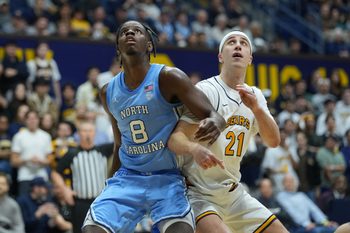 Jan 17, 2026; Berkeley, California, USA; North Carolina Tar Heels forward Caleb Wilson (8) blocks out California Golden Bears guard Nolan Dorsey (21) during the second half at Haas Pavilion. Mandatory Credit: Darren Yamashita-Imagn Images