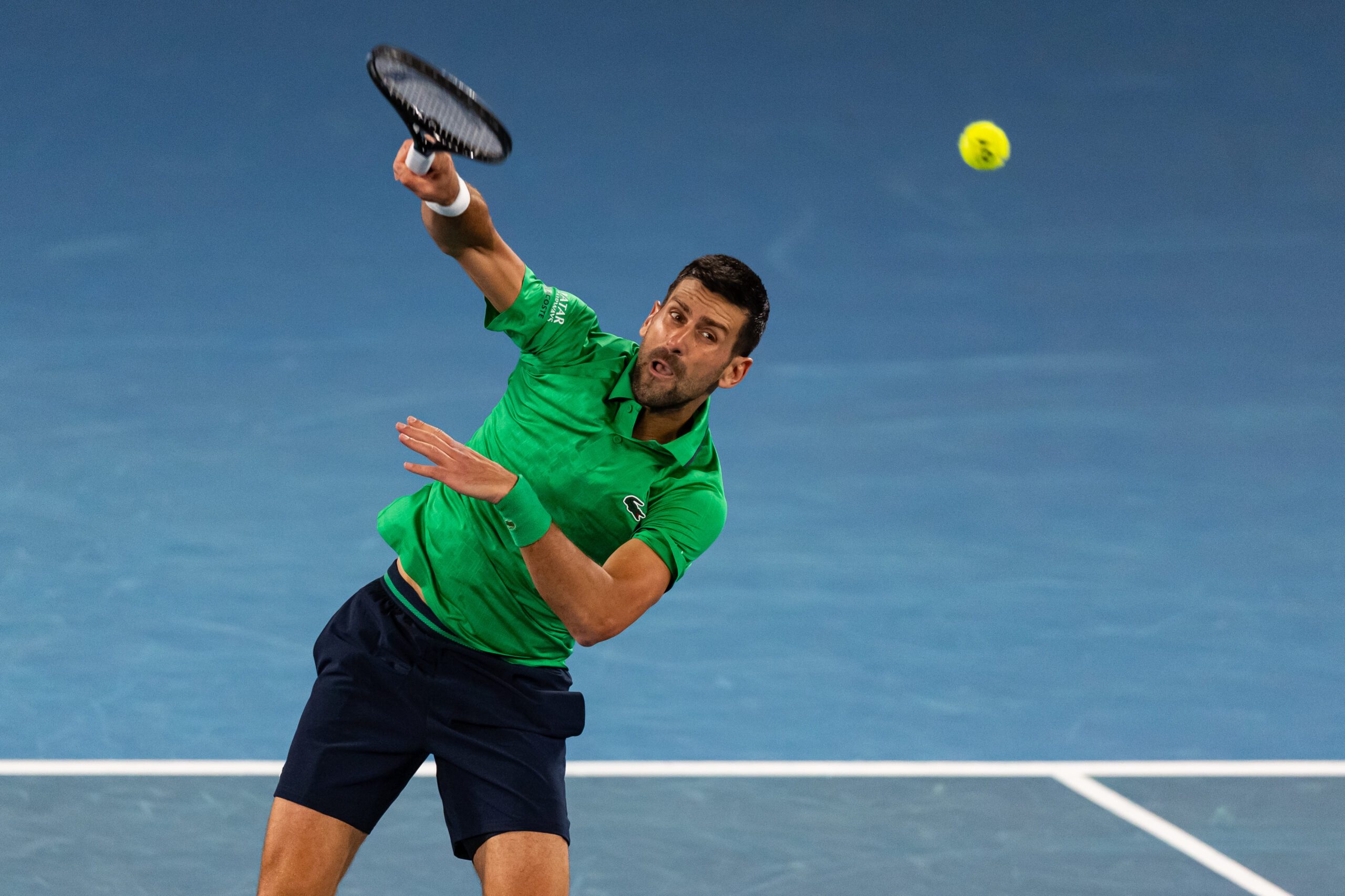 Jan 19, 2026; Melbourne, Victoria, Australia; Novak Djokovic of Serbia in action against Pedro Martinez of Spain in the first round of the men’s singles at the Australian Open at Rod Laver Arena in Melbourne Park. Mandatory Credit: Mike Frey-Imagn Images