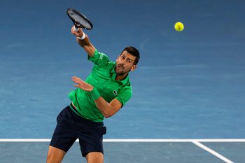 Jan 19, 2026; Melbourne, Victoria, Australia; Novak Djokovic of Serbia in action against Pedro Martinez of Spain in the first round of the men’s singles at the Australian Open at Rod Laver Arena in Melbourne Park. Mandatory Credit: Mike Frey-Imagn Images
