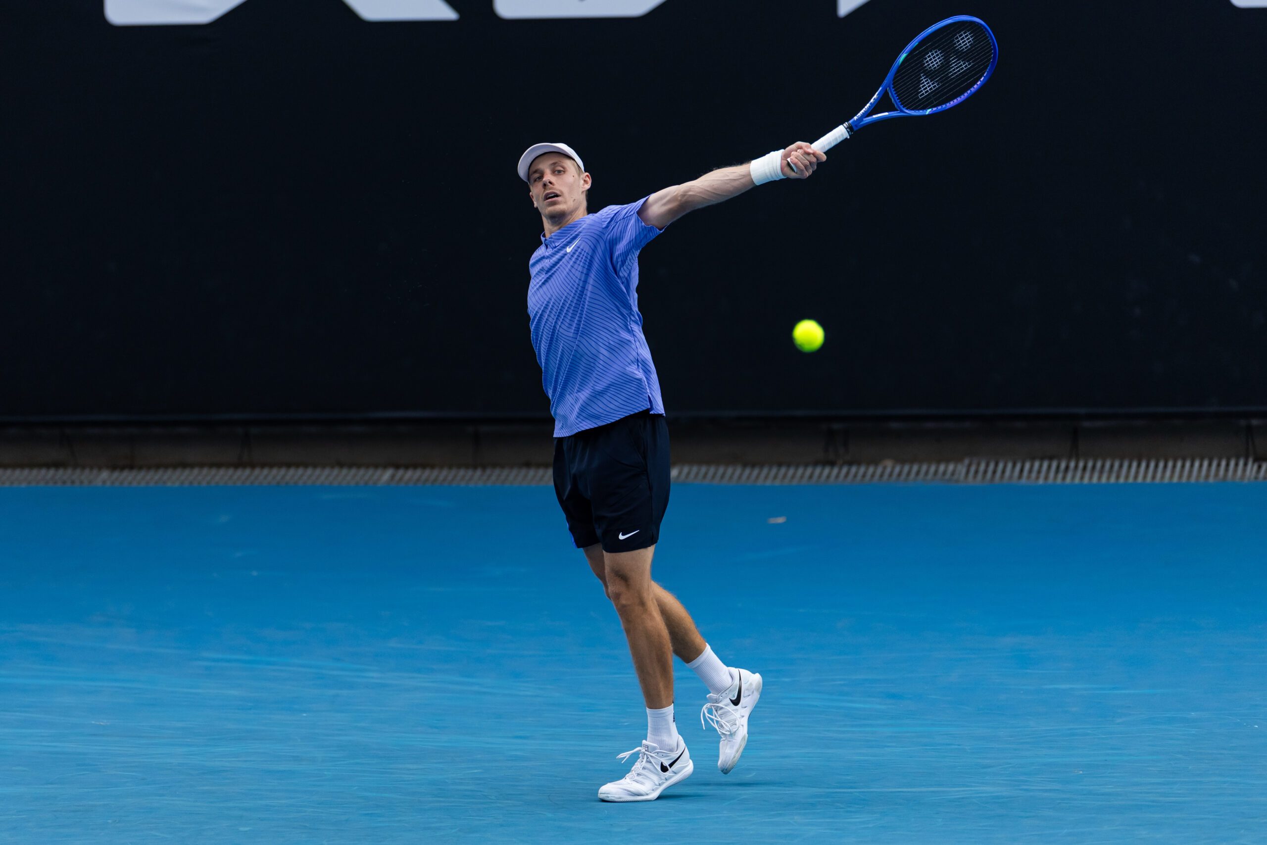 Jan 19, 2026; Melbourne, Victoria, Australia; Denis Shapovalov of Canada in action against Yunchaokete Bu of China in the first round of the men’s singles at the Australian Open at ANZ Arena in Melbourne Park. Mandatory Credit: Mike Frey-Imagn Images
