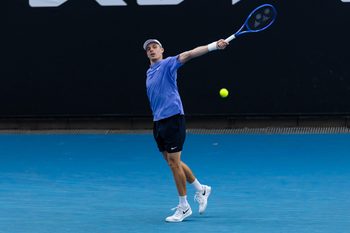 Jan 19, 2026; Melbourne, Victoria, Australia; Denis Shapovalov of Canada in action against Yunchaokete Bu of China in the first round of the men’s singles at the Australian Open at ANZ Arena in Melbourne Park. Mandatory Credit: Mike Frey-Imagn Images