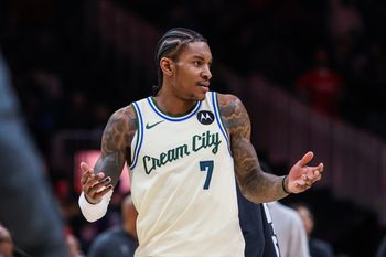 Jan 19, 2026; Atlanta, Georgia, USA; Milwaukee Bucks guard Kevin Porter Jr. (7) reacts to a call against the Atlanta Hawks during the fourth quarter at State Farm Arena. Mandatory Credit: Jordan Godfree-Imagn Images