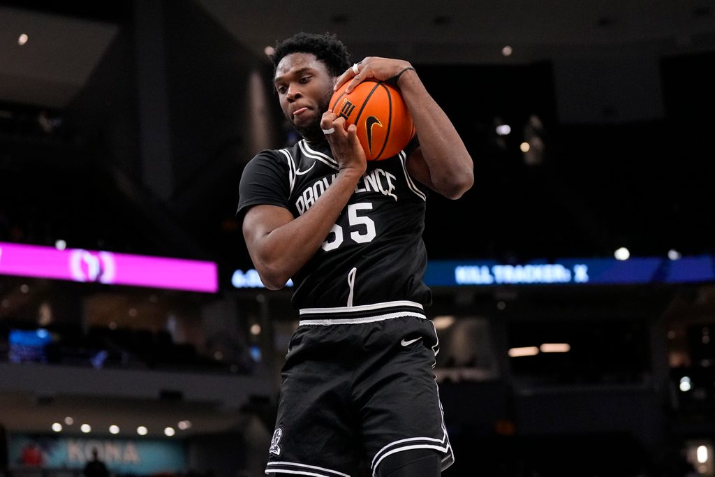 Jan 19, 2026; Milwaukee, Wisconsin, USA; Providence Friars forward Oswin Erhunmwunse (55) grabs a rebound during the second half against the Marquette Golden Eagles at Fiserv Forum. Mandatory Credit: Jeff Hanisch-Imagn Images