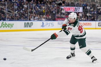 Jan 19, 2026; Toronto, Ontario, CAN; Minnesota Wild forward Kirill Kaprizov (97) shoots the puck against the Toronto Maple Leafs during the second period at Scotiabank Arena. Mandatory Credit: John E. Sokolowski-Imagn Images