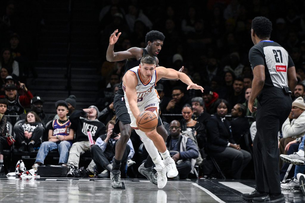 Jan 19, 2026; Brooklyn, New York, USA; Phoenix Suns guard Grayson Allen (8) vies for the ball against Brooklyn Nets guard/forward Drake Powell (4) during the second half at Barclays Center. Mandatory Credit: John Jones-Imagn Images