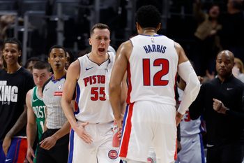 Jan 19, 2026; Detroit, Michigan, USA;  Detroit Pistons forward Duncan Robinson (55) celebrates with forward Tobias Harris (12) after defeating the Boston Celtics at Little Caesars Arena. Mandatory Credit: Rick Osentoski-Imagn Images