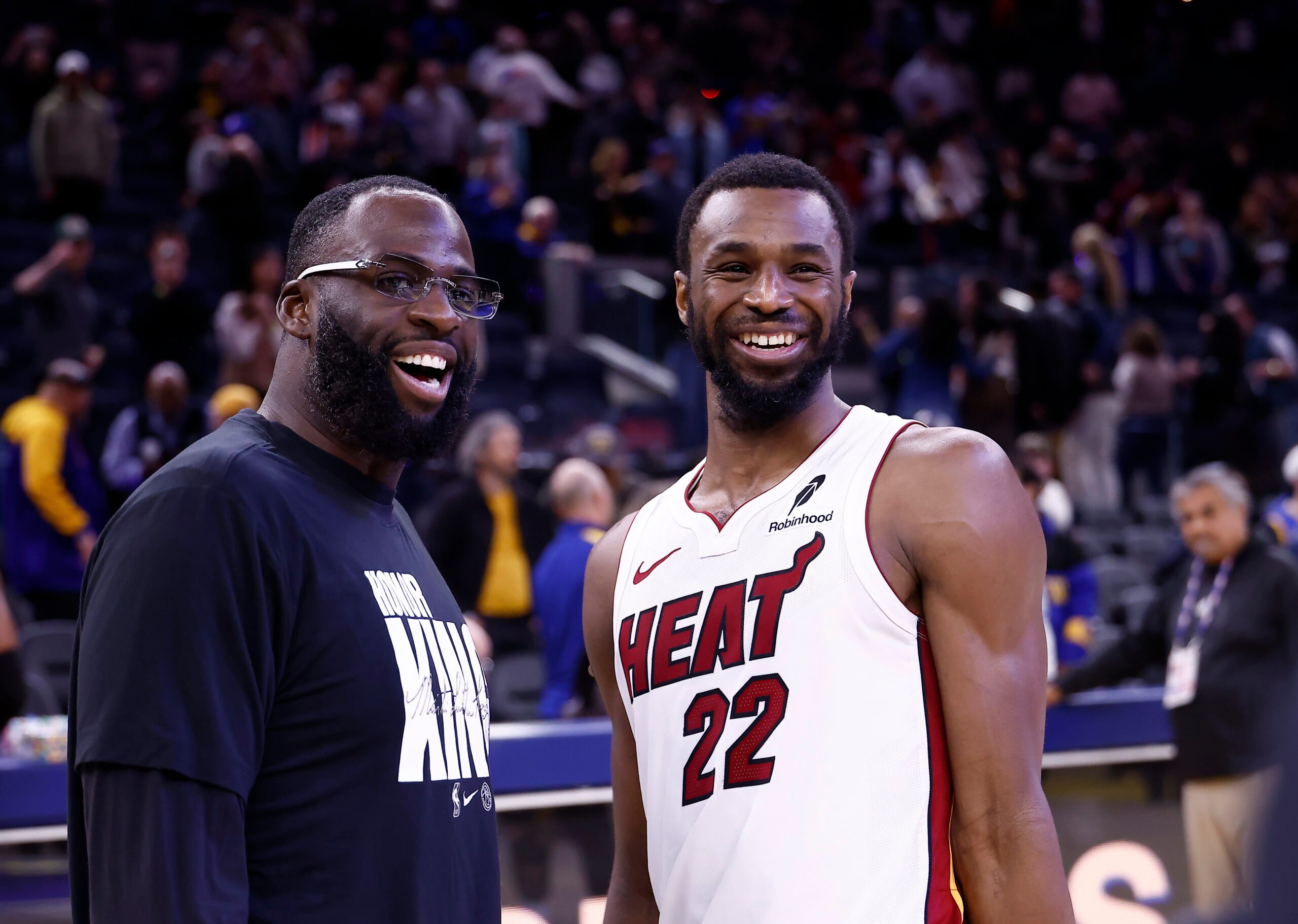 Jan 19, 2026; San Francisco, California, USA; Golden State Warriors forward Draymond Green (23) smiles with Miami Heat forward Andrew Wiggins (22) after the game at Chase Center. Mandatory Credit: Kelley L Cox-Imagn Images
