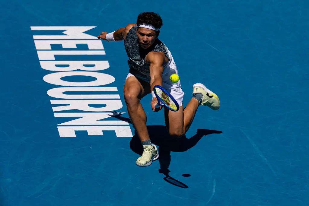 Jan 20, 2026; Melbourne, Victoria, Australia; Ben Shelton of United States in action against Ugo Humbert of France in the first round of the menís singles at the Australian Open at Rod Laver Arena in Melbourne Park. Mandatory Credit: Mike Frey-Imagn Images