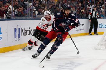 Jan 20, 2026; Columbus, Ohio, USA; Columbus Blue Jackets right wing Kirill Marchenko (86) carries the puck as Ottawa Senators center Michael Amadio (22) trails the play during the first period at Nationwide Arena. Mandatory Credit: Russell LaBounty-Imagn Images