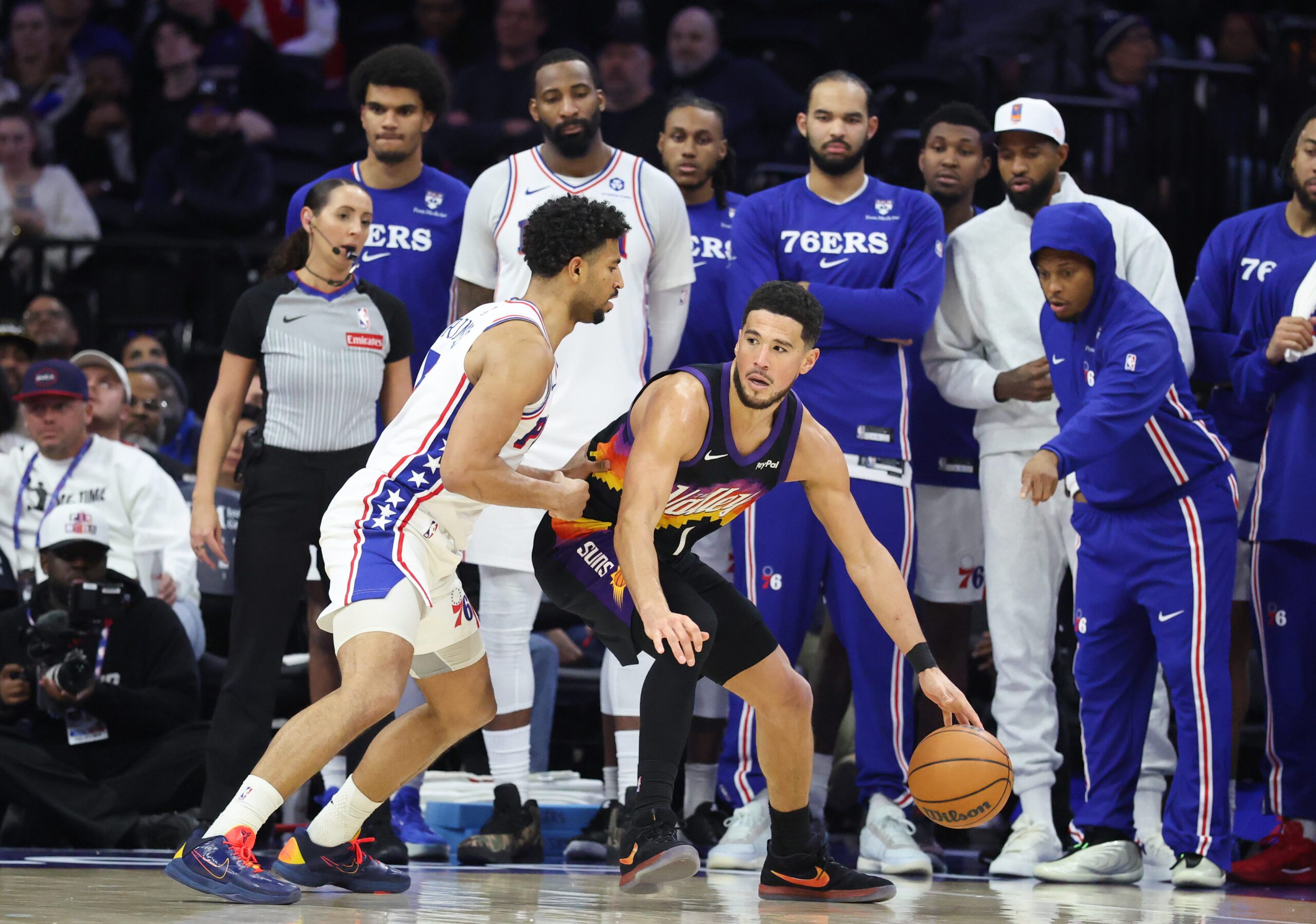 Jan 20, 2026; Philadelphia, Pennsylvania, USA; Phoenix Suns guard Devin Booker (1) dribbles the ball against Philadelphia 76ers guard Quentin Grimes (5) during the fourth quarter at Xfinity Mobile Arena. Mandatory Credit: Bill Streicher-Imagn Images