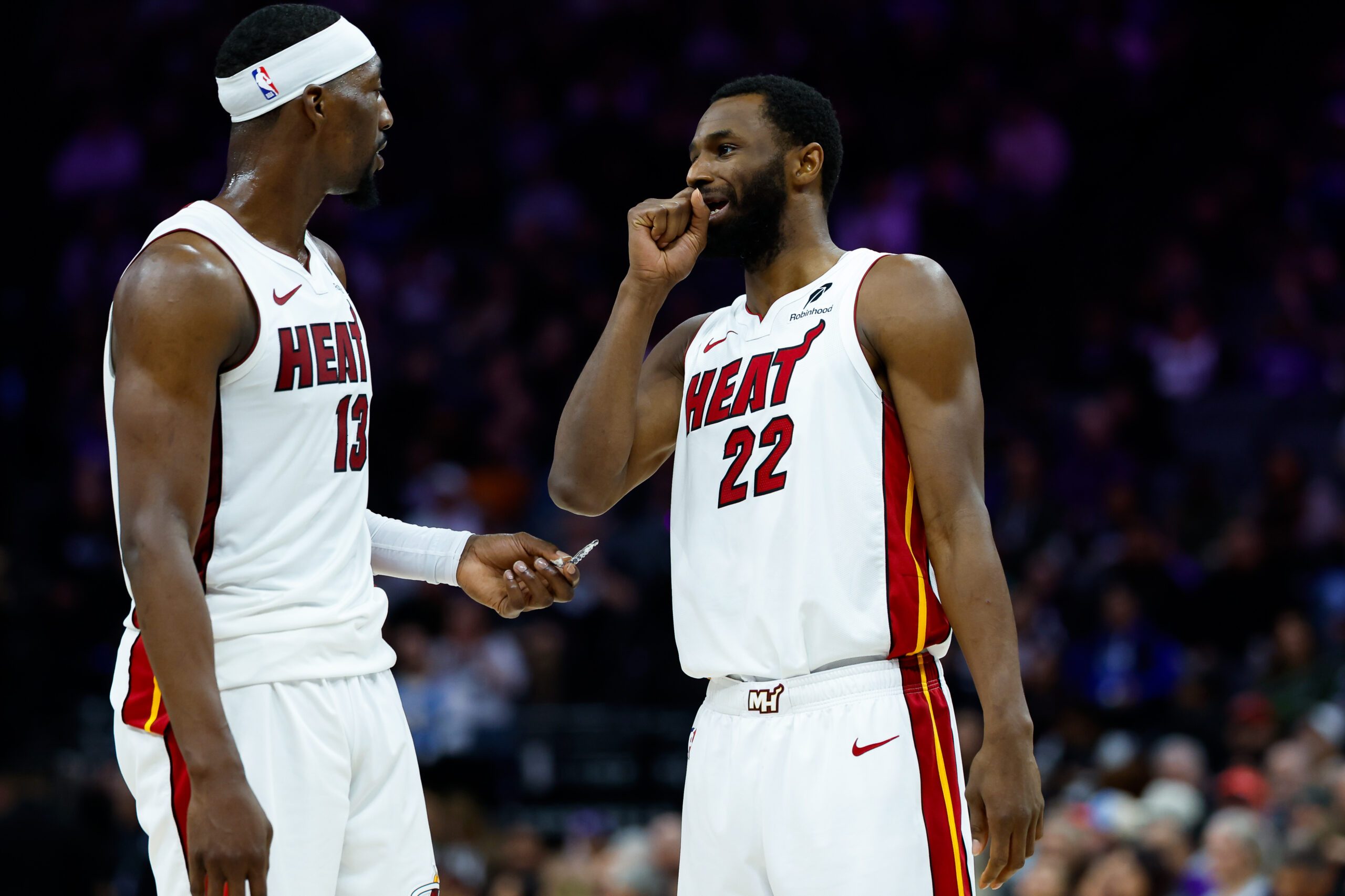 Jan 20, 2026; Sacramento, California, USA; Miami Heat center Bam Adebayo (13) and forward Andrew Wiggins (22) talk a timeout during the second quarter against the Sacramento Kings at Golden 1 Center. Mandatory Credit: Sergio Estrada-Imagn Images