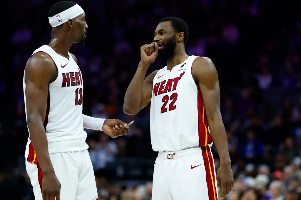 Jan 20, 2026; Sacramento, California, USA; Miami Heat center Bam Adebayo (13) and forward Andrew Wiggins (22) talk a timeout during the second quarter against the Sacramento Kings at Golden 1 Center. Mandatory Credit: Sergio Estrada-Imagn Images