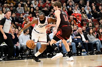 Jan 20, 2026; Chicago, Illinois, USA; LA Clippers guard James Harden (1) drives against Chicago Bulls forward Matas Buzelis (14) during the first half at United Center. Mandatory Credit: Matt Marton-Imagn Images