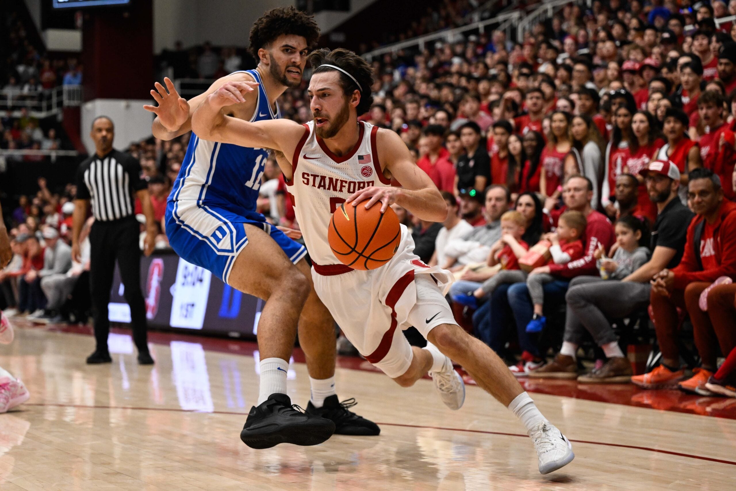 Jan 17, 2026; Stanford, California, USA; Stanford Cardinal guard Benny Gealer (5) drives to the basket against Duke Blue Devils forward Cameron Boozer (12) in the first half at Maples Pavilion. Mandatory Credit: Eakin Howard-Imagn Images