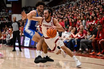 Jan 17, 2026; Stanford, California, USA; Stanford Cardinal guard Benny Gealer (5) drives to the basket against Duke Blue Devils forward Cameron Boozer (12) in the first half at Maples Pavilion. Mandatory Credit: Eakin Howard-Imagn Images