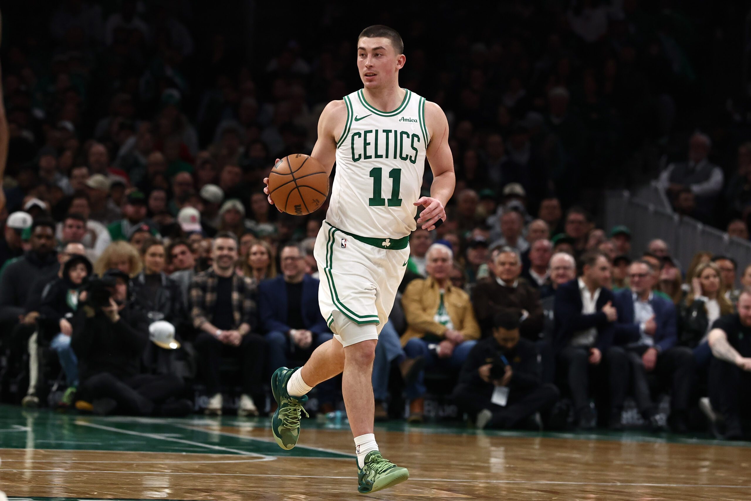Jan 21, 2026; Boston, Massachusetts, USA; Boston Celtics guard Payton Pritchard (11) brings the ball up the court against the Indiana Pacers during the second quarter at TD Garden. Mandatory Credit: Winslow Townson-Imagn Images
