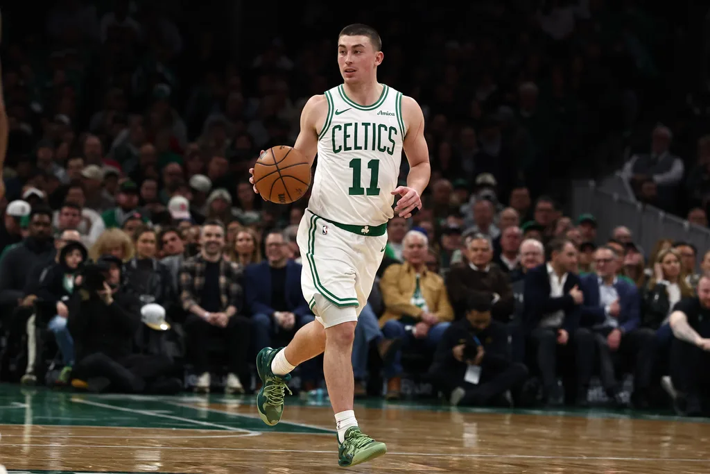 Jan 21, 2026; Boston, Massachusetts, USA; Boston Celtics guard Payton Pritchard (11) brings the ball up the court against the Indiana Pacers during the second quarter at TD Garden. Mandatory Credit: Winslow Townson-Imagn Images