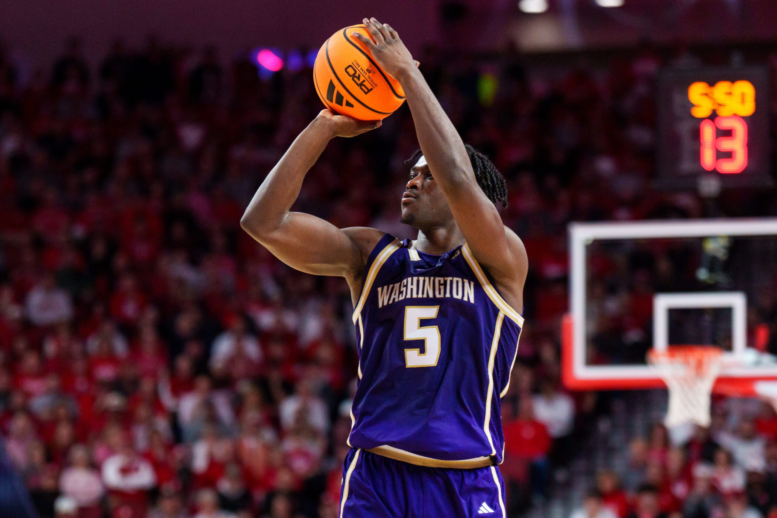 Jan 21, 2026; Lincoln, Nebraska, USA; Washington Huskies guard Zoom Diallo (5) shoots a three-point shot against the Nebraska Cornhuskers during the second half at Pinnacle Bank Arena. Mandatory Credit: Dylan Widger-Imagn Images
