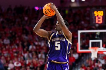 Jan 21, 2026; Lincoln, Nebraska, USA; Washington Huskies guard Zoom Diallo (5) shoots a three-point shot against the Nebraska Cornhuskers during the second half at Pinnacle Bank Arena. Mandatory Credit: Dylan Widger-Imagn Images