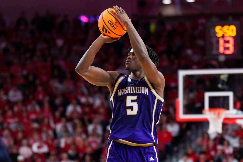 Jan 21, 2026; Lincoln, Nebraska, USA; Washington Huskies guard Zoom Diallo (5) shoots a three-point shot against the Nebraska Cornhuskers during the second half at Pinnacle Bank Arena. Mandatory Credit: Dylan Widger-Imagn Images