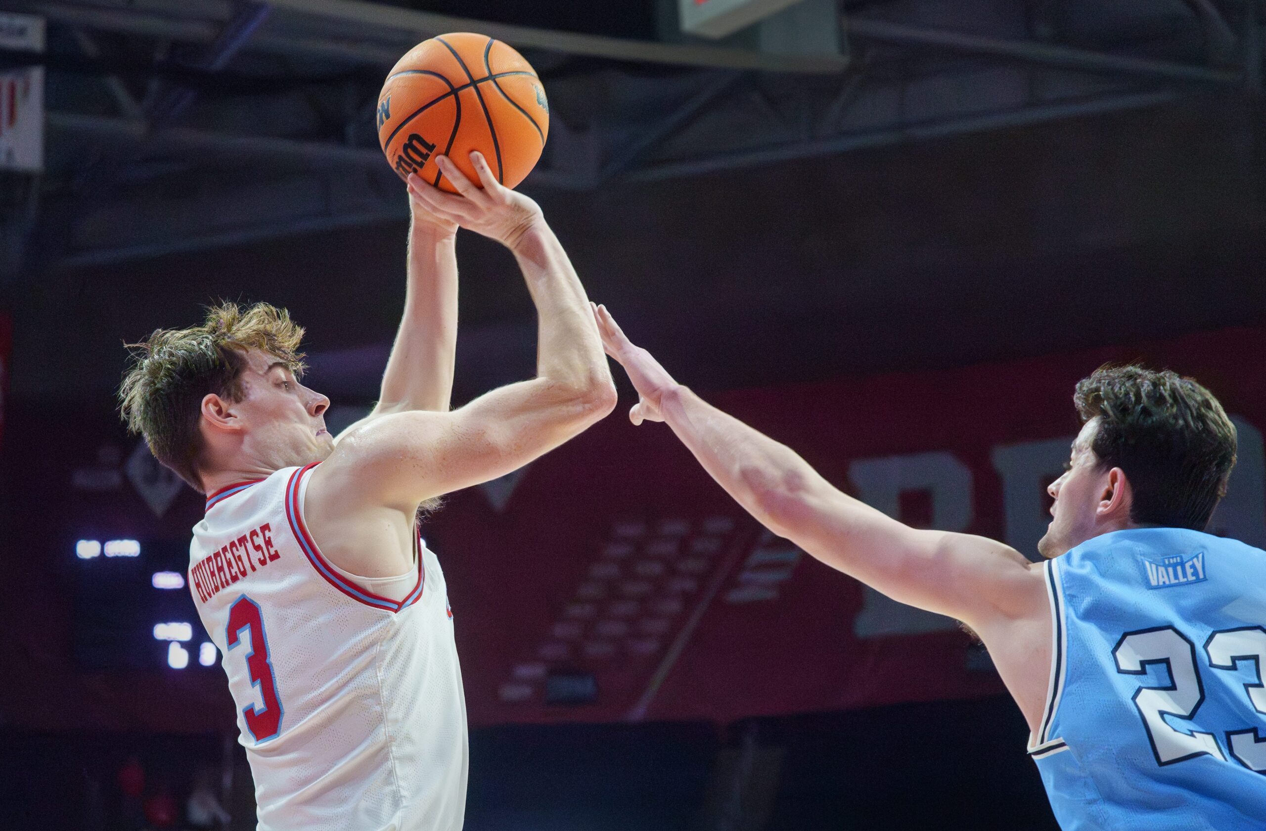 Bradley’s Alex Huibretgse, left, puts up a shot over Indiana State’s Ian Scott in the second half of their college basketball game Wednesday, Jan. 21, 2026 at Carver Arena. The Braves mounted a last-minute rally to defeat the Sycamores 75-68.
