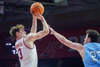 Bradley’s Alex Huibretgse, left, puts up a shot over Indiana State’s Ian Scott in the second half of their college basketball game Wednesday, Jan. 21, 2026 at Carver Arena. The Braves mounted a last-minute rally to defeat the Sycamores 75-68.