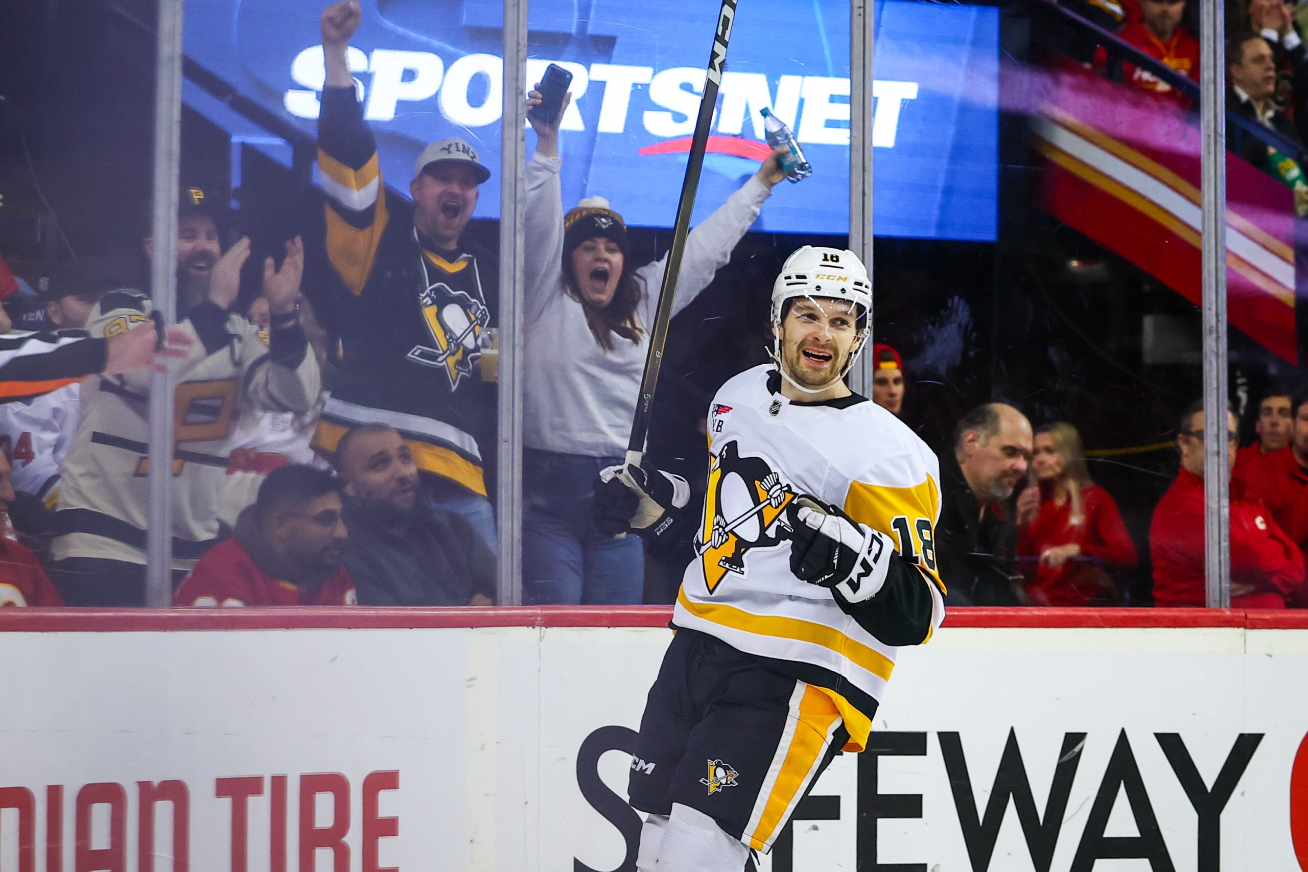 Jan 21, 2026; Calgary, Alberta, CAN; Pittsburgh Penguins center Tommy Novak (18) celebrates his goal against the Calgary Flames during the third period at Scotiabank Saddledome. Mandatory Credit: Sergei Belski-Imagn Images