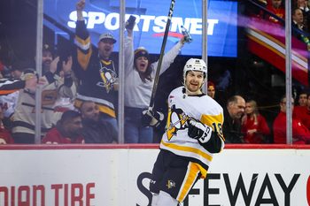 Jan 21, 2026; Calgary, Alberta, CAN; Pittsburgh Penguins center Tommy Novak (18) celebrates his goal against the Calgary Flames during the third period at Scotiabank Saddledome. Mandatory Credit: Sergei Belski-Imagn Images