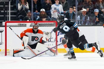 Jan 21, 2026; Salt Lake City, Utah, USA; Utah Mammoth right wing Clayton Keller (9) scores a goal against Philadelphia Flyers goaltender Samuel Ersson (33) to win the game in overtime at Delta Center. Mandatory Credit: Rob Gray-Imagn Images