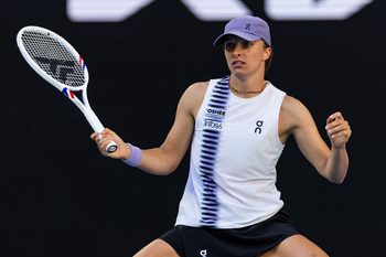 Jan 22, 2026; Melbourne, Victoria, Australia; Iga Swiatek of Poland in action against Marie Bouzkova of Czech Republic in the second round of the womenís singles at the Australian Open at John Cain Arena in Melbourne Park. Mandatory Credit: Mike Frey-Imagn Images