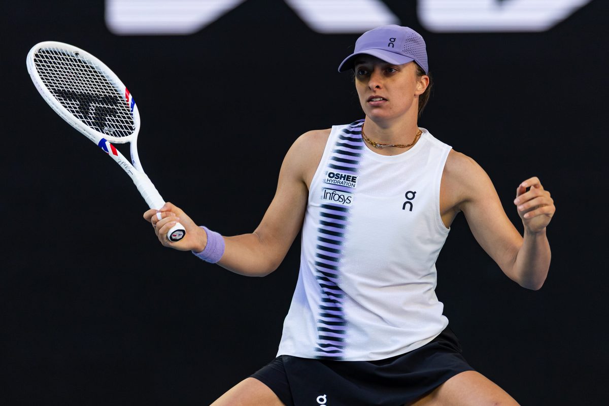 Jan 22, 2026; Melbourne, Victoria, Australia; Iga Swiatek of Poland in action against Marie Bouzkova of Czech Republic in the second round of the womenís singles at the Australian Open at John Cain Arena in Melbourne Park. Mandatory Credit: Mike Frey-Imagn Images