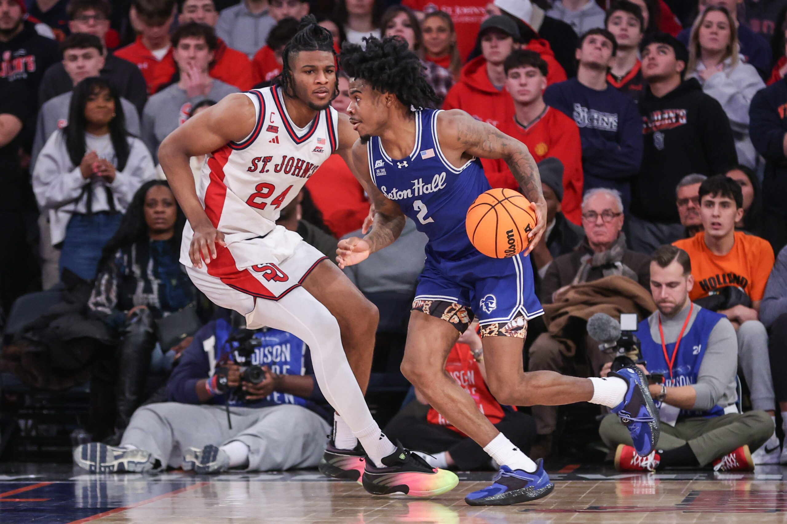 Jan 20, 2026; New York, New York, USA;  Seton Hall Pirates guard Tajuan Simpkins (2) and St. John's Red Storm forward Zuby Ejiofor (24) at Madison Square Garden. Mandatory Credit: Wendell Cruz-Imagn Images