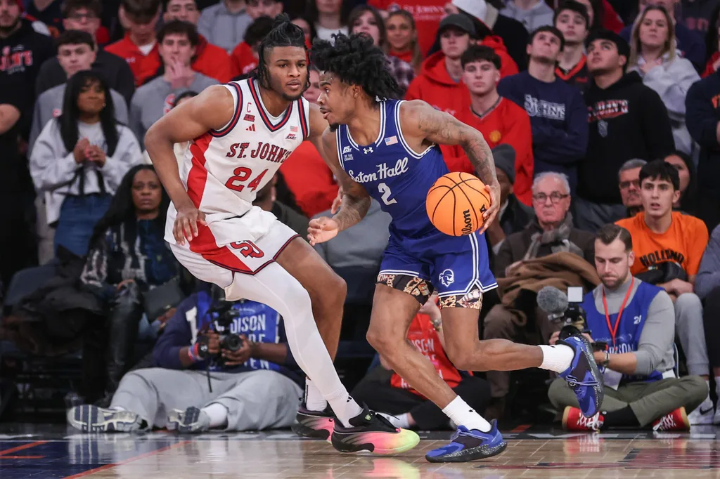 Jan 20, 2026; New York, New York, USA; Seton Hall Pirates guard Tajuan Simpkins (2) and St. John's Red Storm forward Zuby Ejiofor (24) at Madison Square Garden. Mandatory Credit: Wendell Cruz-Imagn Images