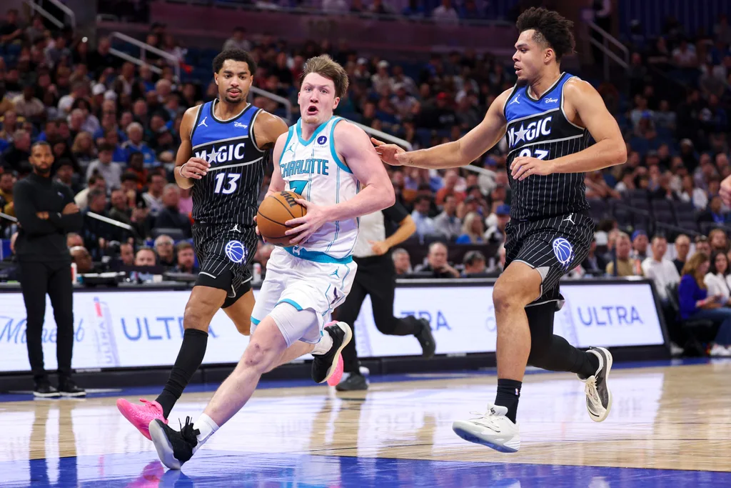 Jan 22, 2026; Orlando, Florida, USA; Charlotte Hornets guard Kon Knueppel (7) drives to the basket against the Orlando Magic in the fourth quarter at Kia Center. Mandatory Credit: Nathan Ray Seebeck-Imagn Images