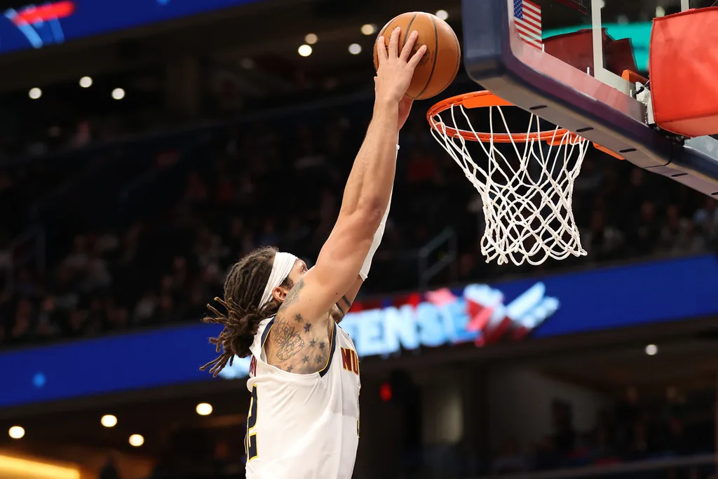 Jan 22, 2026; Washington, District of Columbia, USA; Denver Nuggets forward Aaron Gordon (32) dunks during the second half against the Washington Wizards at Capital One Arena. Mandatory Credit: Daniel Kucin Jr.-Imagn Images
